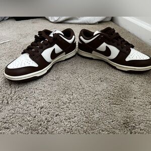 Brown Nike dunks.